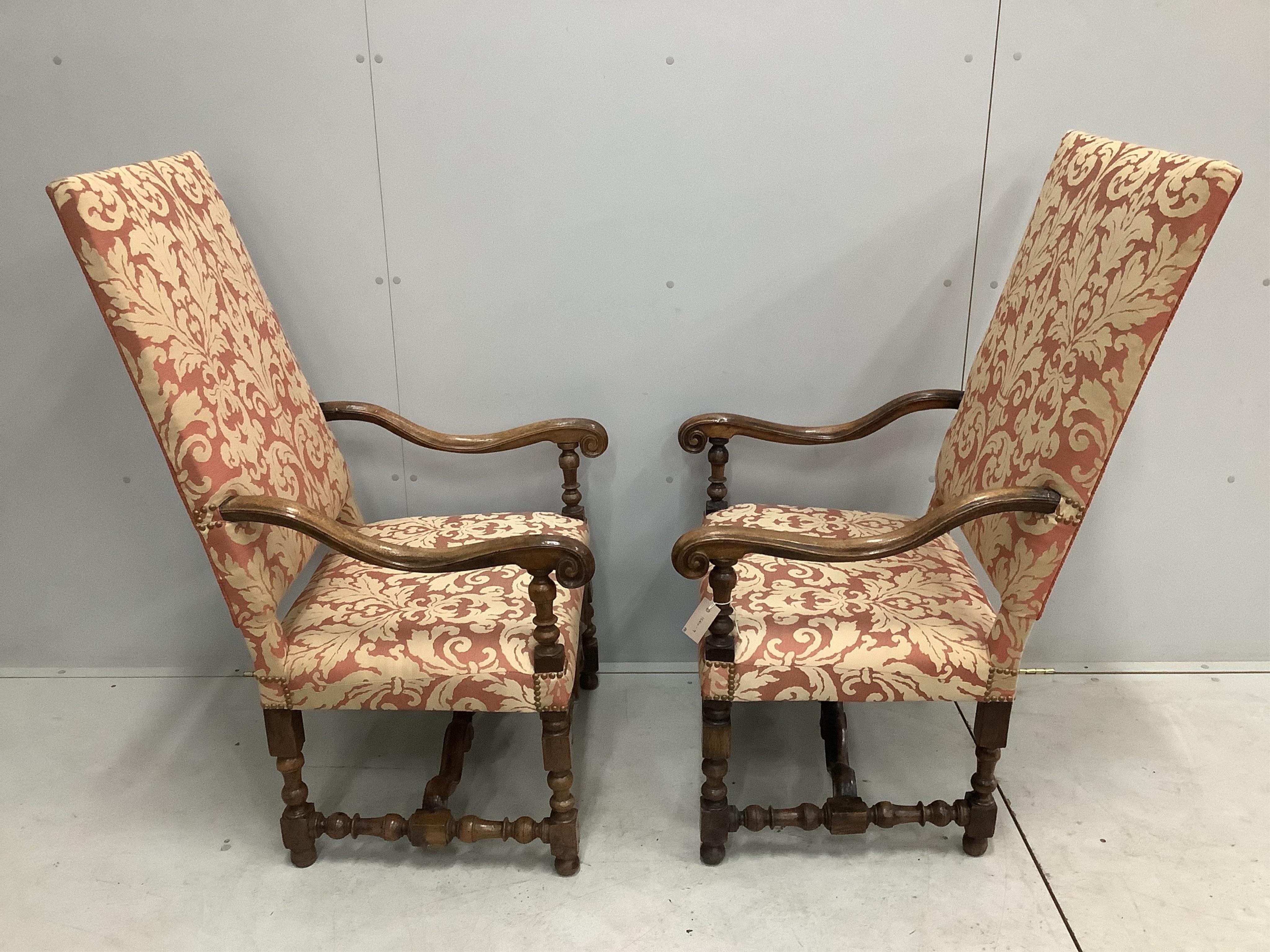 A pair of Louis XIV style walnut open armchairs, width 66cm, height 121cm. Condition - light rubbing to arms otherwise good